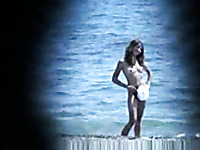 Spy video on the local nude beach - two hot naked mature babes