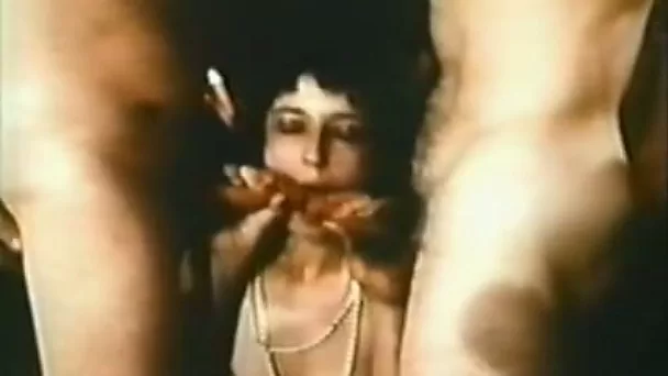 Rapacious brunette pokes her wide mouth with two hot sausages deep throat
