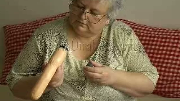 Incredibly horny granny fucks her fat snatch with her sex toy