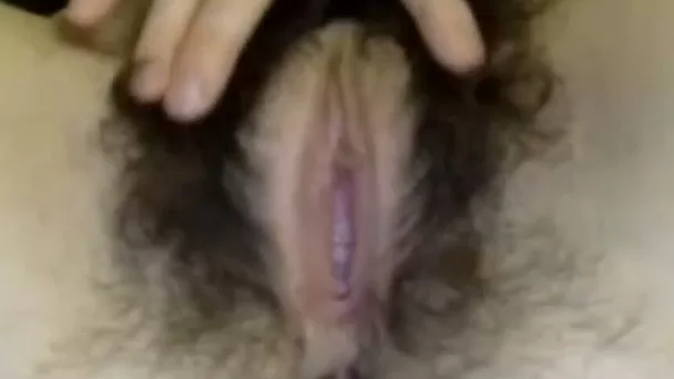 Close up of girl playing with massive hairy bush