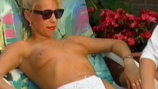 Skinny blonde housewife gets her body oiled up outdoors