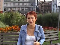 Mature euro redhead short-haired woman gives an interview