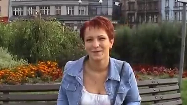Mature euro redhead short-haired woman gives an interview