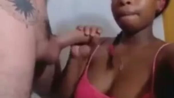 Sucking a white lollipop