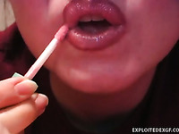 Watch amateur bitch putting on some lipstick on her sexy lips
