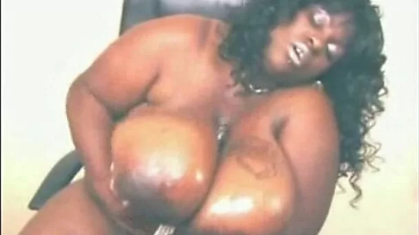 Amateur South African webcam bitch plays with her gigantic tits
