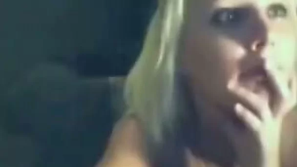 Lusty blonde in undershirt flashes her appetizing tits