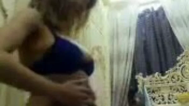 Skanky Iraqi MILF wife teases with her big tits in blue bra