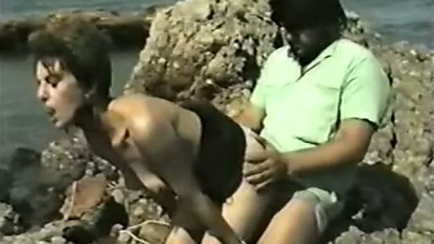 Skinny mature dark-haired bitch gets nailed on the beach