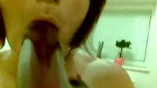 Naughty girlfriend playing with her oiled tits and sucking long black cock
