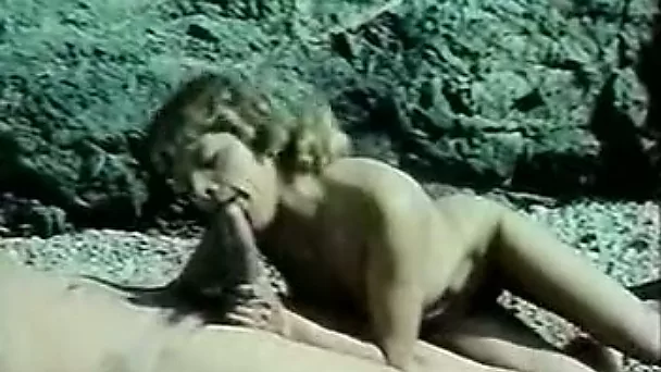 Hairy man fucking a busty brunette whore on the beach