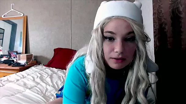 Blonde cosplay model Rae Bootn fondling her firm tits