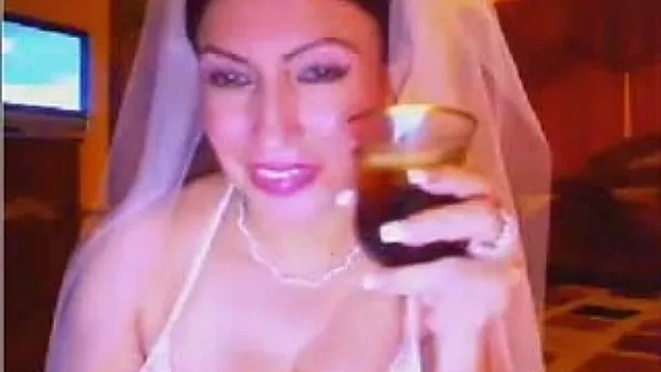 Bosomy webcam whore in bride's dress licks her delicious tits