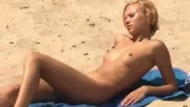 My skinny blonde girlfriend gets naked on the nude beach