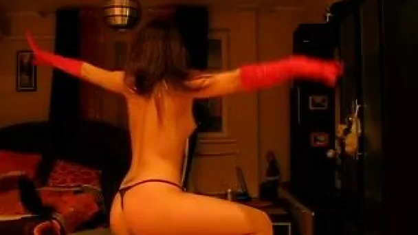 Naughty brunette bitch stripping near the chair