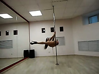 Breath taking pole dancing by leggy brunette babe