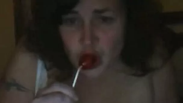 Mature mommy is sucking lollipop and pleasing her coochie with candy