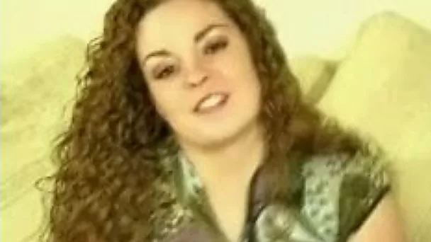Curly babe with perky tits strips and plays with her coochie on camera