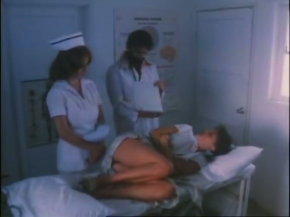 Kinky gyno doctor examines hairy snatch of one lustful patient photo
