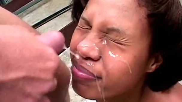 Cute amateur ebony chick sucks hard white dick and takes facial