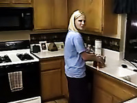 Cute blonde housewife gives her hubby blowjob in kitchen