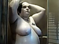 Obese mature brunette wife in the shower masturbating