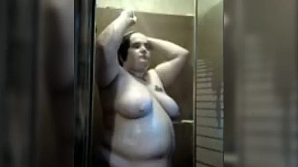 Obese mature brunette wife in the shower masturbating