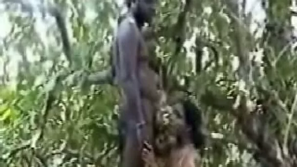 Chubby tribal chick sucks a cock somewhere in the woods