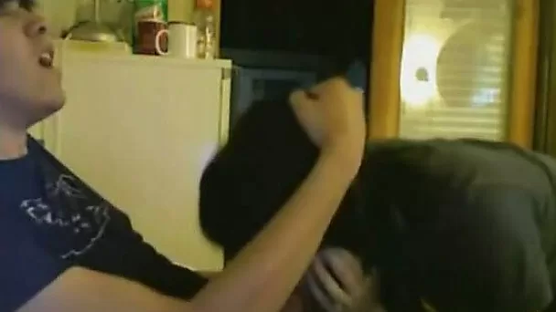 Two girls having, or maybe it is just a guy who looks like a girl