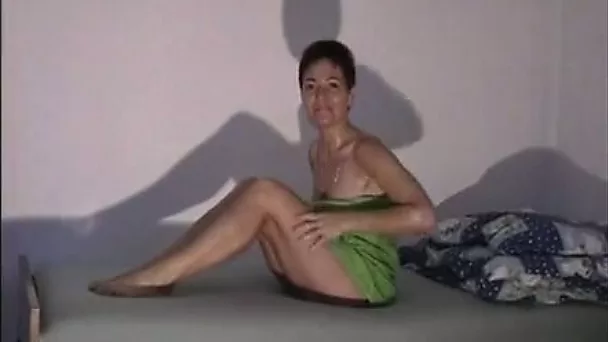 This woman seems very at ease with being naked and she loves showering