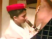 Asian flight attendant babe gives blowjob in hotel room