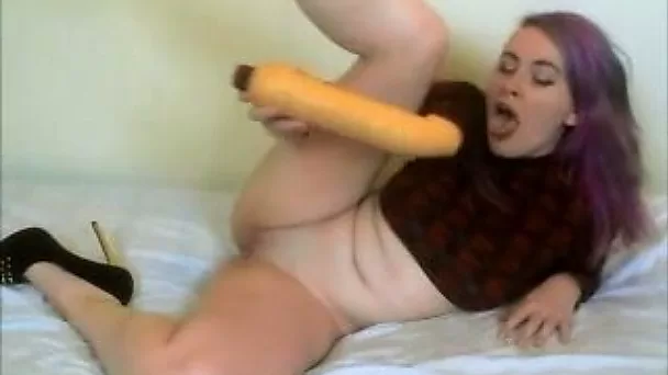 busty slut fucks her pussy with a big dildo