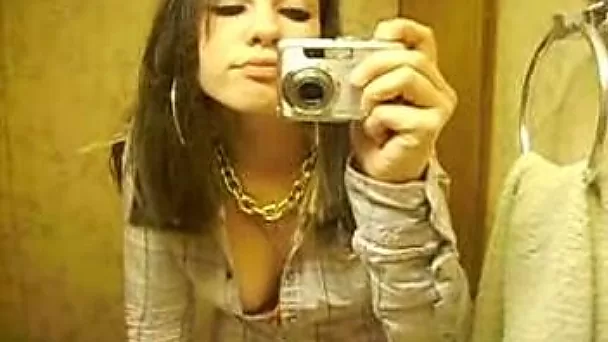Beautiful brunette girlfriend stripteasing in the bathroom for me