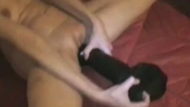Filthy wife stretches her pussy to its limits with black monster dildo
