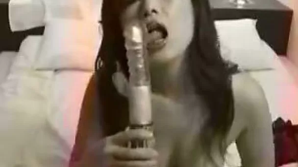 Depraved asian slut gets her itchy and wet pussy penetrated with her plastic toy