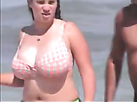 Spying on chubby MILF with huge natural boobs on a beach