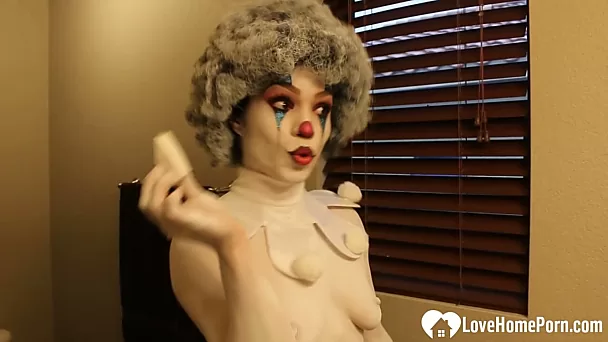 Hot babe gets sprayed into a clown costume
