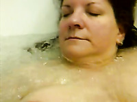 Playing with big boobs of my naughty BBW mature wife in jacuzzi
