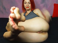 redhead model spreads pussy and show feet