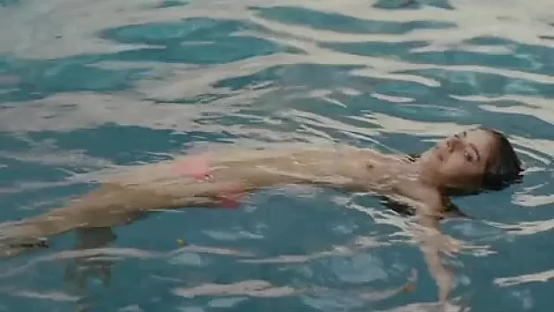 Weronika Rosati flashes her really nice tight titties in the pool