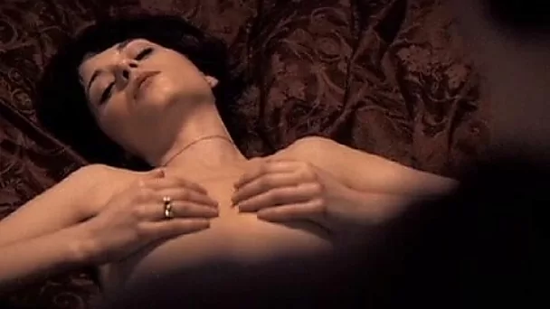 Zooey Deschanel squeezes her nice boobies doing nude bed scene