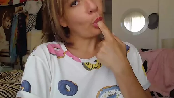 Blonde cougar licking her finger after touch pussy