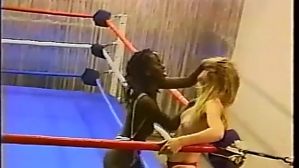 Topless interracial pro style wrestling with body slams, flips, drop kicks, scissors, kicks, knees