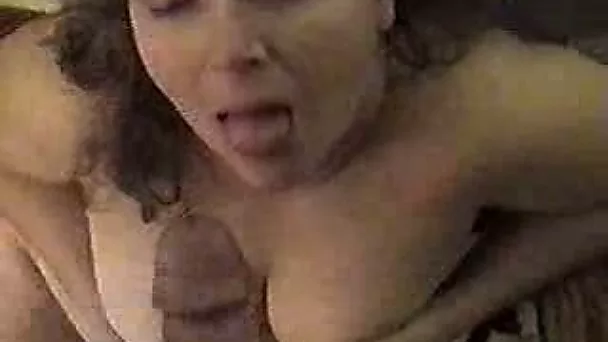 Chunky curly haired wife gives me a titjob and gets her face glazed