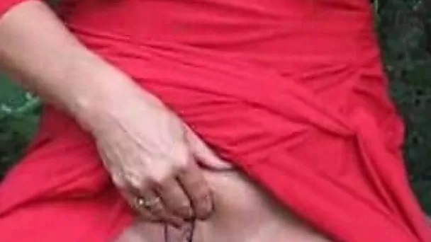 Freaky and horny blonde cougar showing her boobies in the forest