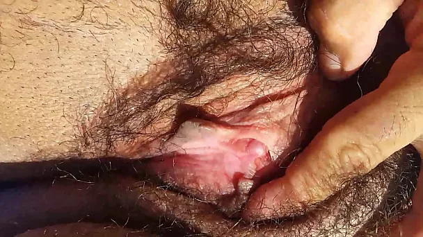 Playing with hairy pussy
