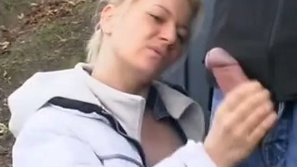Busty blonde strumpet gives a handjob to my hommie