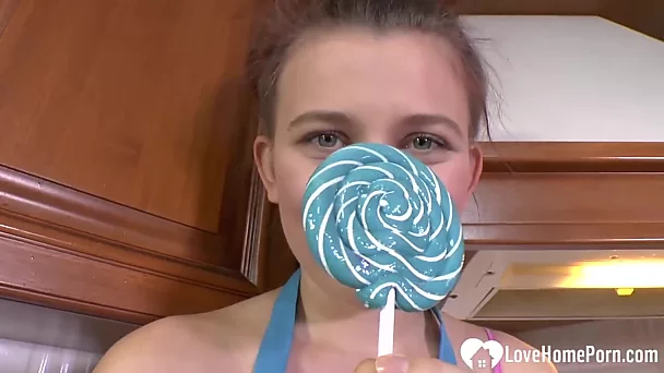 Hot MILF enjoys sucking on a lollipop