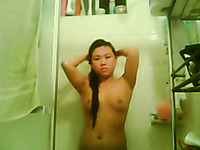Slutty Asian brunette on webcam masturbating with a dildo