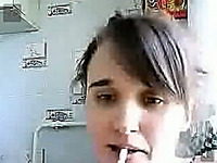 Webcam solo with a teen smoking and flashing her tits